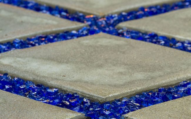 Concrete pathway with blue glass grout