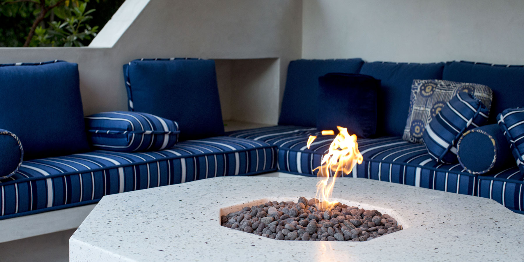 Custom upholstery and terrazzo fire table