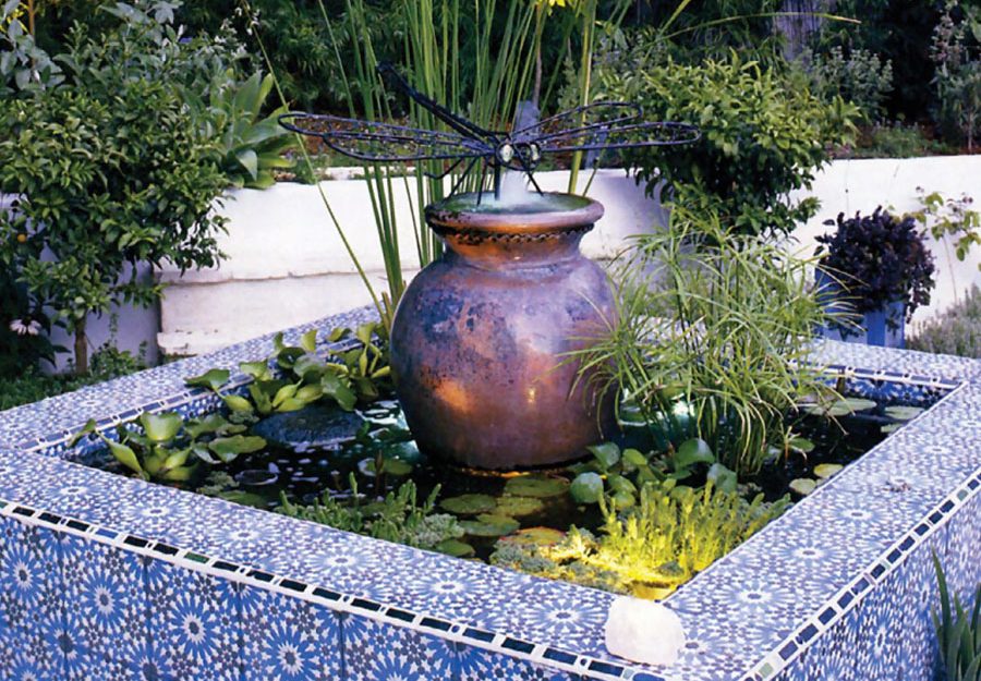 Tiled fountain with a metal dragonfly