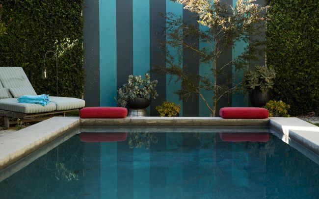 Striped wall end of pool with pot grouping